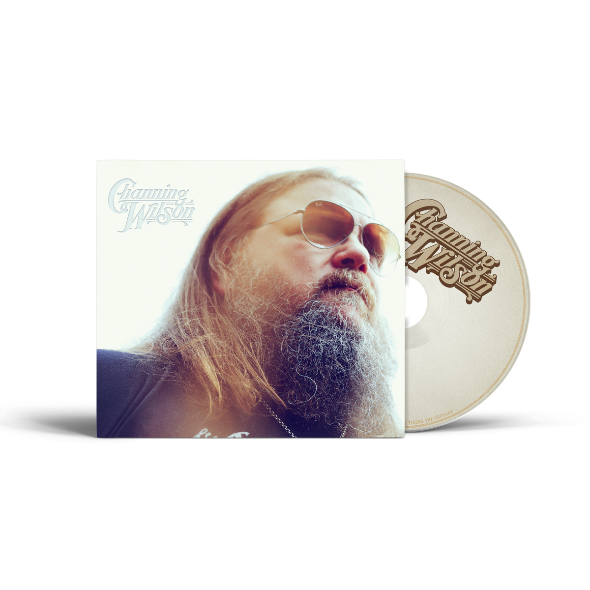 A physical CD album by Channing Wilson, featuring a square sleeve with a portrait of the artist and a matching cream-colored CD disc partially visible behind it, on a clean white background.