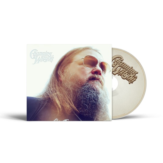 A physical CD album by Channing Wilson, featuring a square sleeve with a portrait of the artist and a matching cream-colored CD disc partially visible behind it, on a clean white background.